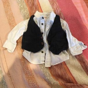 Dark gray vest and white button up shirt